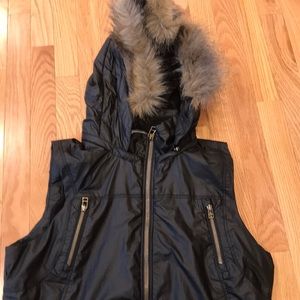 Vest. Pricey Barbour waxy coating,